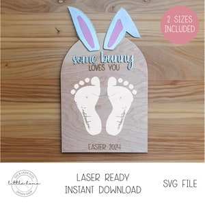 May include: A wooden sign with bunny ears and two white footprints. The sign says "some bunny loves you" and "Easter 2024".