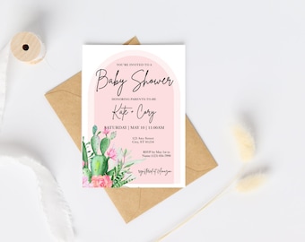 May include: Baby shower invitation with a pink arch design. The invitation features the text "Baby Shower" and the names "Kate & Cory". It includes a cactus and floral illustration. The invitation is on a white background with a brown envelope.
