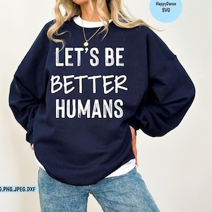 May include: A navy blue sweatshirt with the text "Let's Be Better Humans" printed in white on the front.