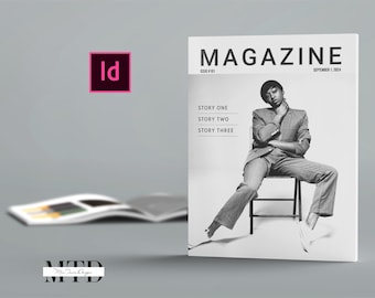May include: A black and white magazine cover with the word "MAGAZINE" in bold, white letters. The cover features a person sitting on a chair, wearing a suit and looking at the camera. The text "STORY ONE", "STORY TWO", and "STORY THREE" is listed on the cover.