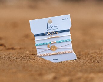 The Best Hair-tie Bracelets! Our new Protect set includes 5 bracelets in colors that bring all the ocean feels, blues, teal, and creams.