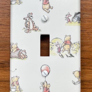 May include: A set of three ceramic mugs with a speckled, matte finish. The mugs are in shades of cream, light gray, and dark gray. Each mug has a simple, minimalist design, perfect for coffee or tea.