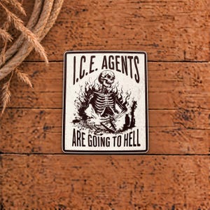 May include: A rectangular sticker with a white background and a black border. The text I.C.E. AGENTS ARE GOING TO HELL is printed in black. The center features a black illustration of a skeleton engulfed in flames, holding a pitchfork.