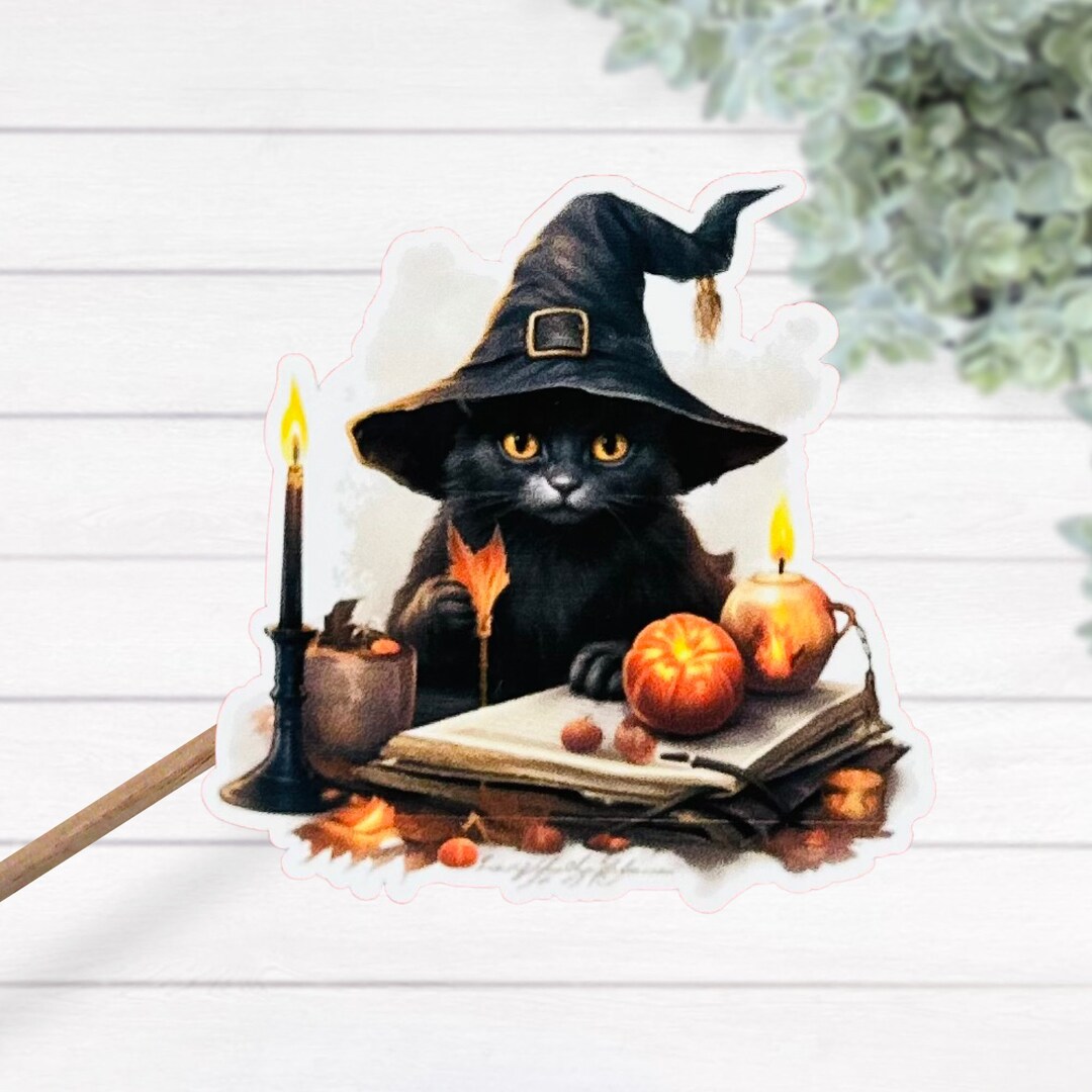 かわいいハロウィン子猫が呪文の本を読んでいる熱ラミネート防水
