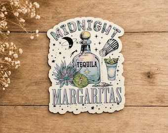 May include: A die-cut sticker featuring a tequila bottle, a salt shaker, a lime wedge, a shot glass, and a succulent. The text reads MIDNIGHT MARGARITAS. The design includes stars, a crescent moon, and a pile of salt, rendered in pastel colors.