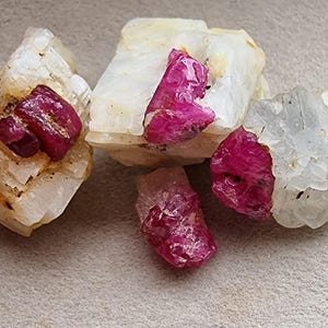 RUBY Crystal Rough. 04 Ruby Crystal. Burma Origin. Unheated Untreated Natural. RED on white. Solution Lab Certified. Ig The Lotus Gem
