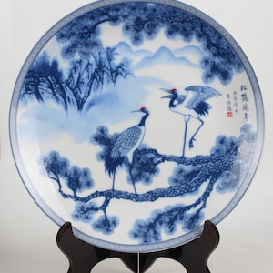 A folk collection of hand-painted blue and white porcelain plates