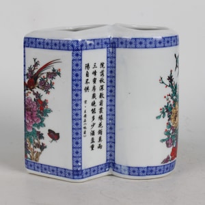 Hand-painted blue and white porcelain pen holder from a folk collection