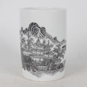 A folk collection of hand-painted ceramic pen holders