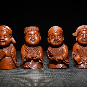 A folk collection of hand-carved boxwood  statues