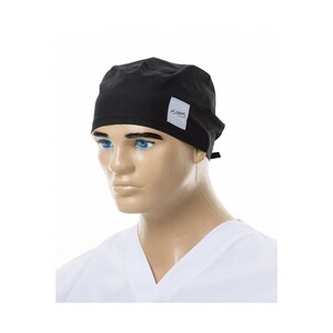 May include: Black surgical scrub cap with a white label that says "A-Dress".