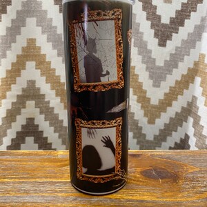Haunted house hallway art, glow in the dark tumbler.  20 oz travel cup with gold framed scary blood splattered images.
