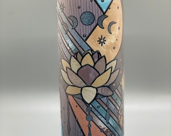 Boho stain glass lotus moon with moon phases.  Glow in the dark 20 oz tumbler for hot or cold drinks.  Comes with lid and straw.