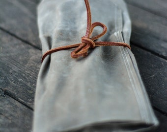 Organizer Roll made out of beewaxed canvas. Handy to keep your equipment organised and carrying tools in backpack.