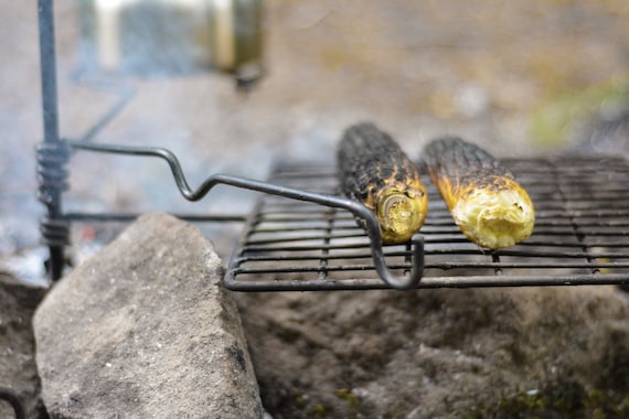 Campfire cooking top grates swing arm