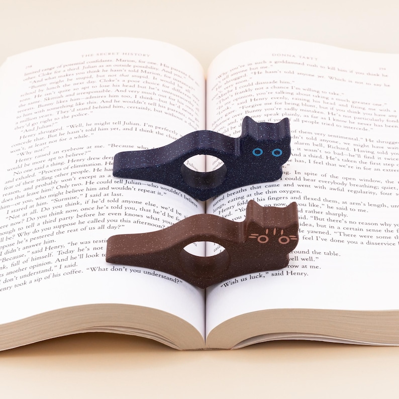 Glitter blue and brown tabby cat thumb book page holders with bookmark, ergonomic and playful design, perfect gift for book lovers, adds charm to reading, ideal for birthdays, anniversaries, or as a stocking stuffer, a practical and adorable reading companion