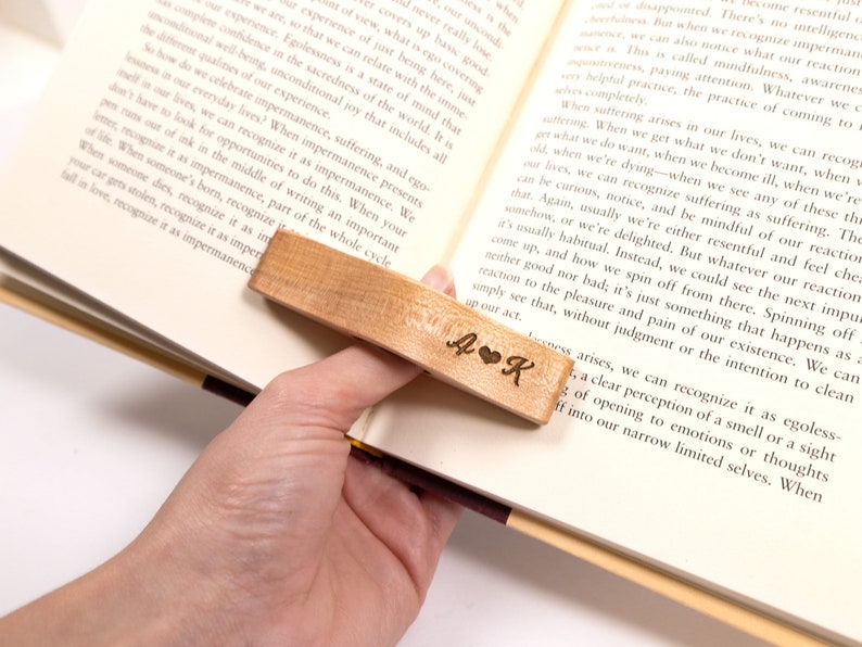 Wooden personalized page holder keeping open a book
