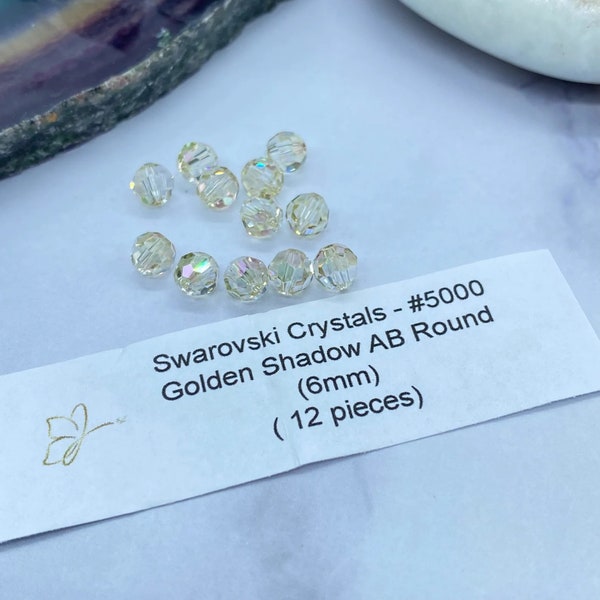 Genuine Swarovski® #5000 Golden Shadow AB Crystals 6mm, Golden Light Tan AB round crystals 6mm, 12 pieces/pack, only two packs left.