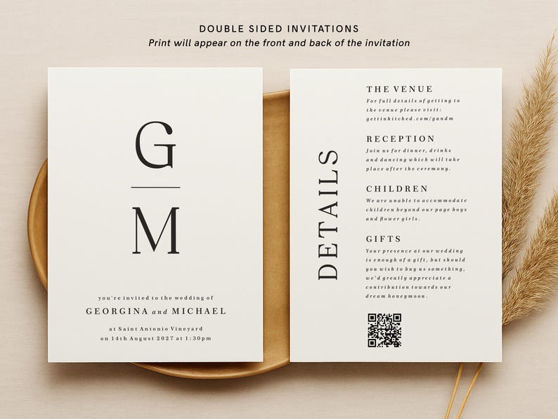 May include: A double-sided wedding invitation with a minimalist design. The front features the initials "G" and "M" in a serif font. The back includes details about the venue, reception, children, and gifts. The text reads "THE VENUE", "RECEPTION", "CHILDREN", and "GIFTS".