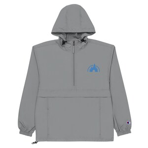 May include: A grey hooded windbreaker with a blue embroidered castle logo on the front. The jacket has a zip closure and a drawstring at the bottom.