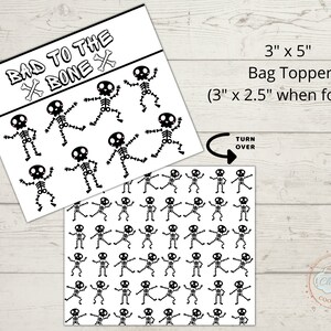 May include: A printable 3 x 5 inch bag topper featuring a black and white skeleton design with the text "Bad to the Bone" and a skull and crossbones. The topper can be folded to 3 x 2.5 inches.