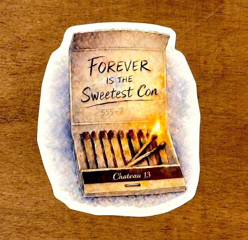 May include: A sticker featuring a matchbox design with the text "FOREVER IS THE Sweetest Con" and "Chateau 13". The matchbox is open, with several matches and a lit match with a flame.
