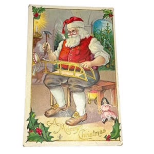 Antica cartolina di Natale del 1912 con Babbo Natale che costruisce una slitta