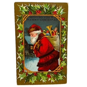 Cartolina d'auguri di Natale antica del 1910 con Babbo Natale e sacco di regali