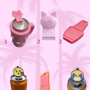 May include: A collection of pink can toppers and accessories. Includes a pink can cooler with a bow, a cat-shaped can topper, a pink nail polish-shaped can topper, a winking emoji can topper, a pink lipstick-shaped can topper, and a laughing emoji can topper.