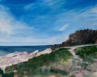 May include: An oil painting depicts a coastal scene with a bright blue sky and a dark blue ocean. The foreground features green grass and white rocks. A path leads to a wooded area on the right. Signed by E. Courtney.
