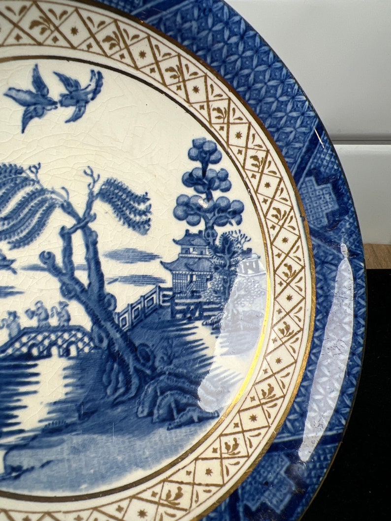 A collection of Booths 'Real Old Willow' pattern tablewares, including fourteen dinner pla