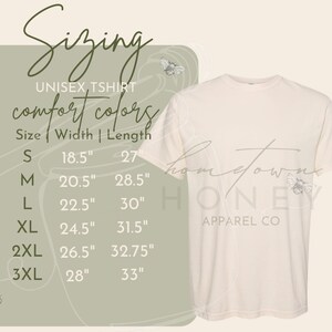 May include: Sizing chart for a unisex t-shirt with the text "comfort colors" and "Hometown Honey Apparel Co."  The chart shows sizes S through 3XL with corresponding width and length measurements in inches.