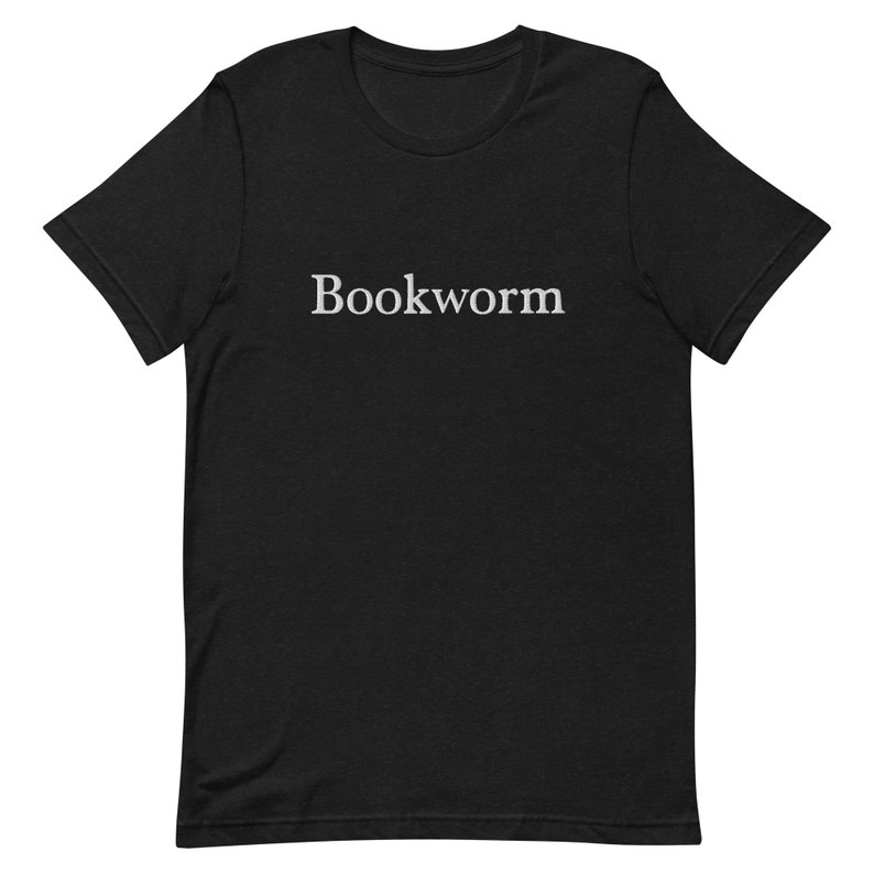 May include: Black t-shirt with the word "Bookworm" printed in white on the front.