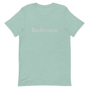 May include: A light blue t-shirt with the word "Bookworm" printed in white on the front.