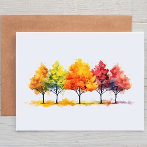May include: Watercolor painting of five trees in a row. The trees are painted in shades of yellow, orange, red, and purple. The trees are set against a white background.