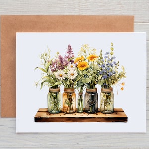 May include: Five mason jars filled with colorful wildflowers, including purple, yellow, white, and blue flowers, arranged on a rustic wooden shelf.