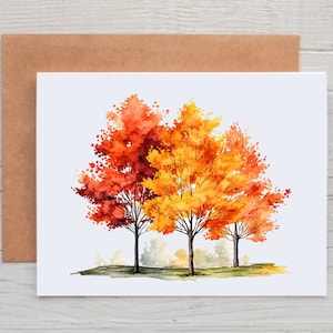 May include: Watercolor painting of three trees with orange, yellow, and red leaves. The trees are set against a white background.