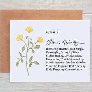 May include: A white card with the text "She is Worthy" and a watercolor floral design. The card includes the text "Proverbs 31" and a list of positive affirmations. The card is paired with a brown envelope.