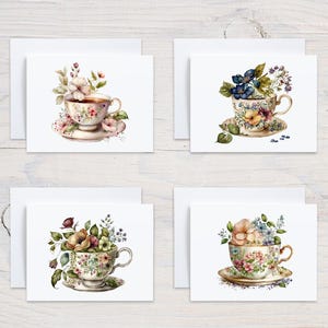 May include: Four white cards with watercolor illustrations of teacups filled with flowers. Each card features a different floral arrangement in a teacup.