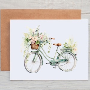 May include: A watercolor painting of a green bicycle with a basket full of flowers. The bicycle has a brown wicker basket and a white seat. The flowers are pink, white, and green.