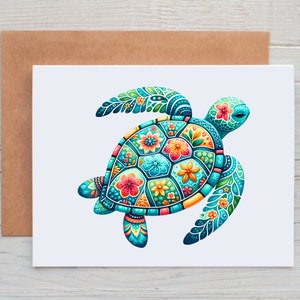May include: A greeting card featuring a colorful sea turtle design. The turtle has a turquoise head and flippers, with a shell adorned with flowers in shades of red, orange, and yellow. The card is on a white background, with a brown envelope behind it.