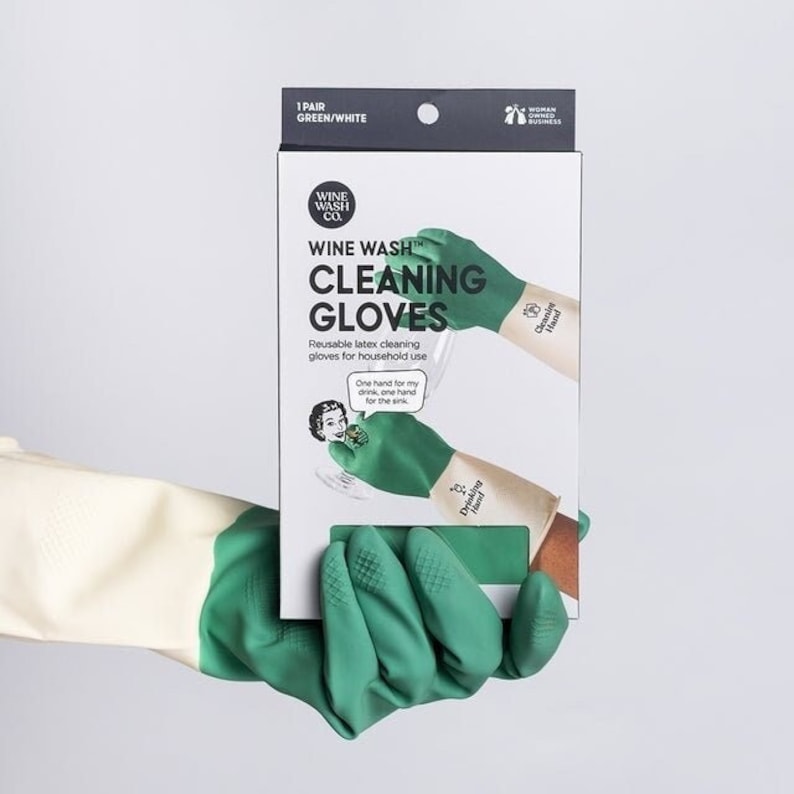 May include: A pair of green and white reusable latex cleaning gloves with the text "Wine Wash Cleaning Gloves" and "One hand for my drink, one hand for the sink" on the packaging.