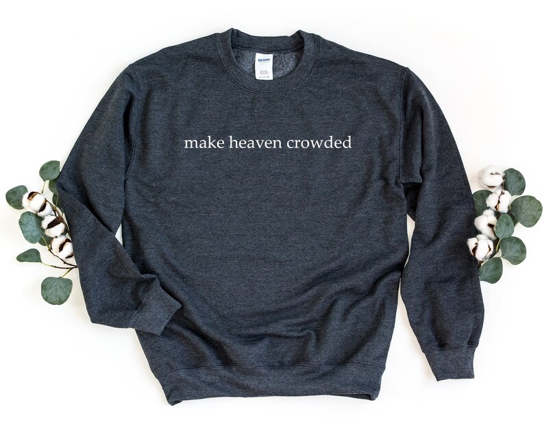 May include: A dark gray sweatshirt with the text "make heaven crowded" printed in white on the front.
