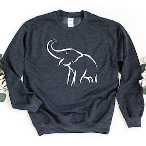 May include: A dark gray sweatshirt with a white outline of an elephant on the front.