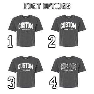 four gray t-shirts with the word "CUSTOM" printed on them. Each t-shirt has a different font size and style, allowing for customization of the text.