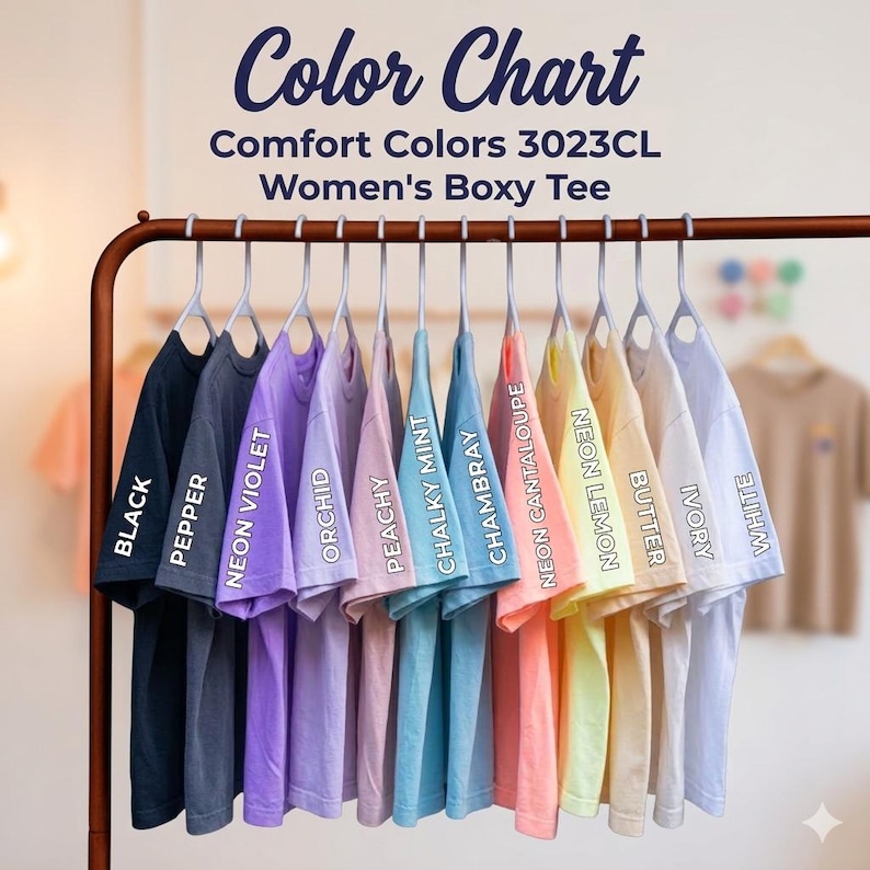 A row of colorful t-shirts hanging on a clothing rack, with each shirt having a different color.