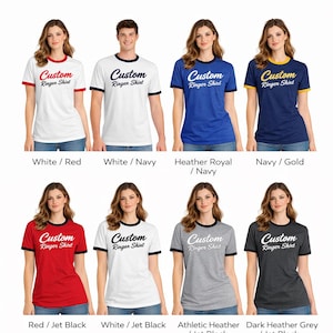 a collection of t-shirts in various colors, including white, red, navy, gold, white/navy, navy/royal, and grey, as well as a navy/gold t-shirt. The t-shirts feature the text "Custom" and "Ringer Shirt" printed on them.