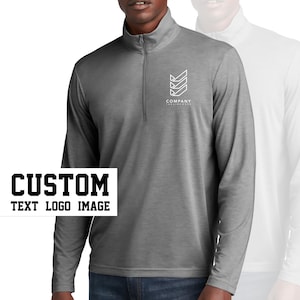 May include: A gray long-sleeve shirt with a zippered collar. The shirt has a white geometric logo with the text "COMPANY" below it. The text "CUSTOM TEXT LOGO IMAGE" is in black letters on a white background.