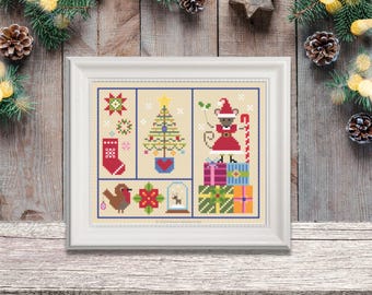 May include: A cross-stitch pattern featuring a Christmas scene with a mouse wearing a Santa hat, a Christmas tree, presents, a stocking, a robin, and a poinsettia. The pattern is framed in a white frame.