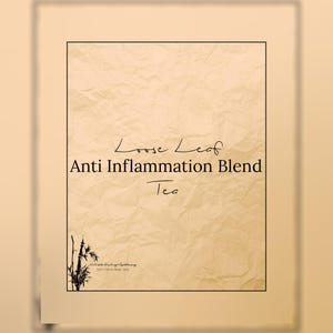 May include: A beige paper with the text "Loose Leaf Anti Inflammation Blend Tea" in a black, handwritten font. A black bamboo illustration is in the lower left corner. The paper has a textured, wrinkled appearance.
